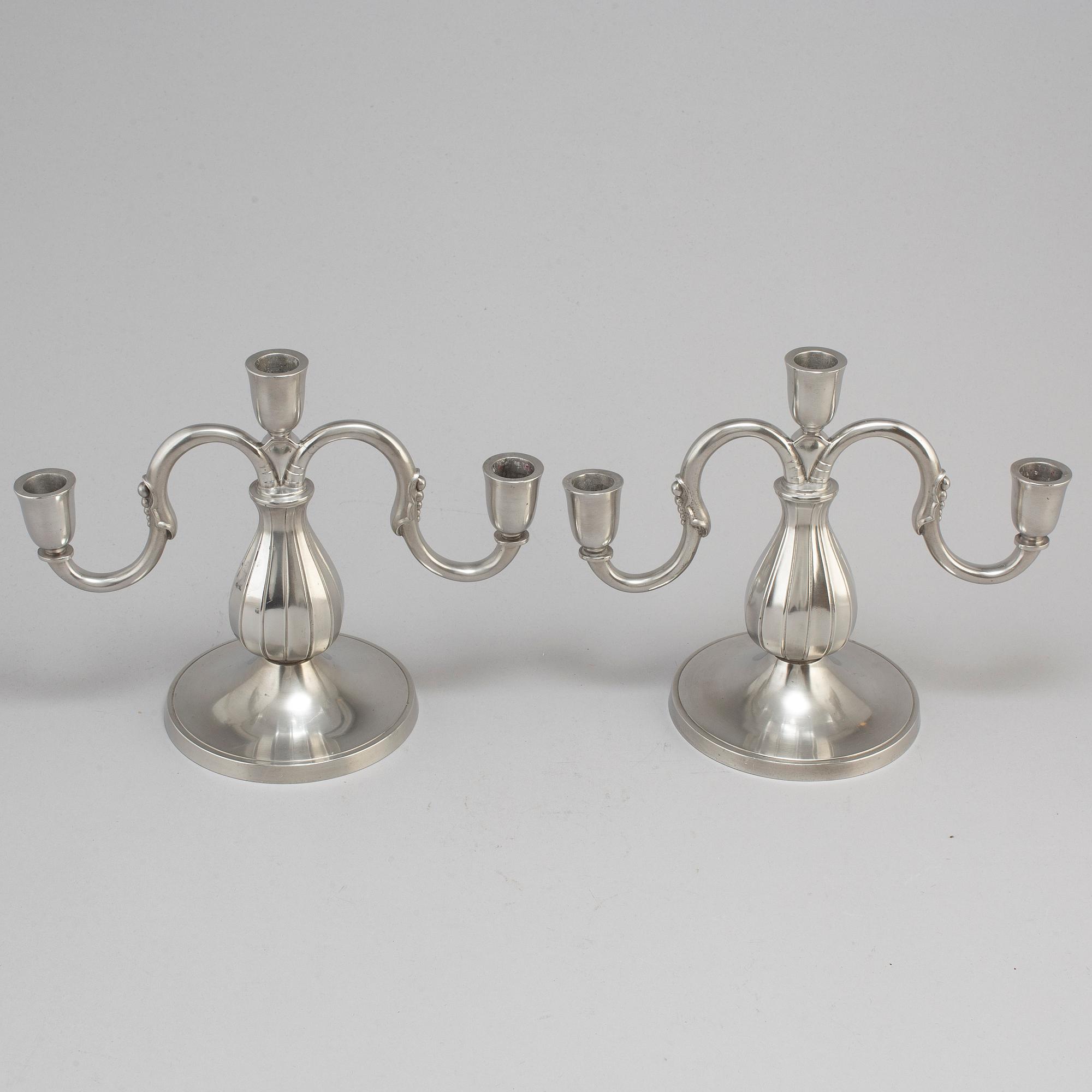 A pair of pewter candelabra from GAB Tenn, Stockholm, 1935.