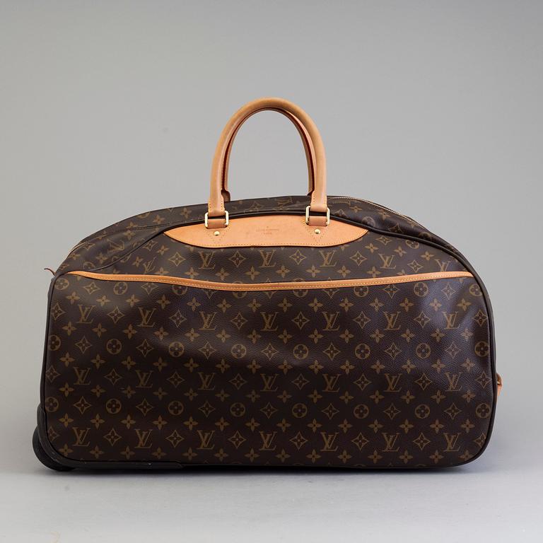 A bag Eole 50 Rolling Carry On, Louis Vuitton.