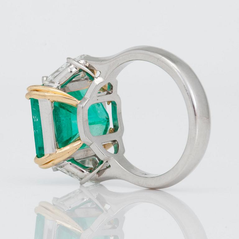 A 8.11ct emerald ring with diamonds.