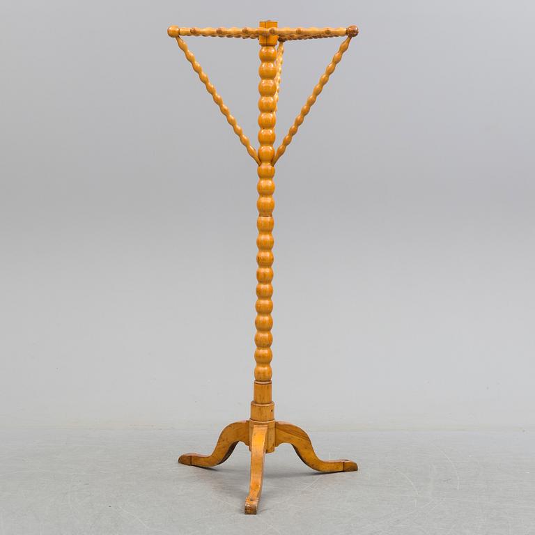 A turned birch clothes hanger, circa 1900.