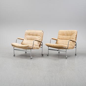 Bruno Mathsson, a pair of easy chairs and a coffee table, 'Karin', Dux, second half of the 20th Century.
