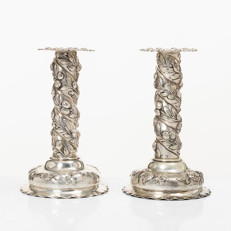 A pair of Baroque-style silver candle sticks, with Swedish import marks, first half of the 20th century.