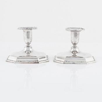 A Swedish Silver Ladle, mark of Adolf Öström, Piteå 1887 and a pair of Silver Candlesticks.