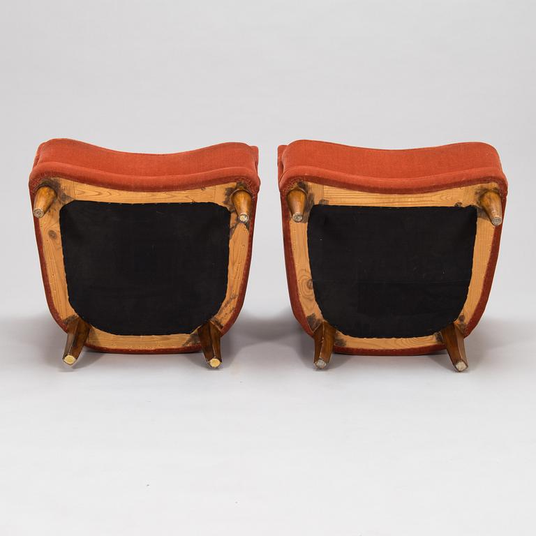 A pair of mid-20th-century armchairs.