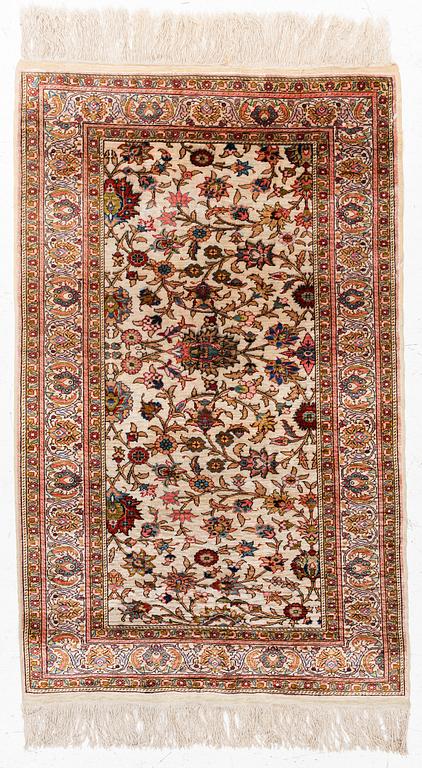 An Oriental silk rug, c. 122 x 76 cm.