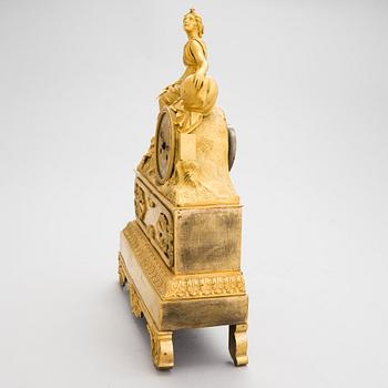 A French Empire mantel clock from 1820s-30s.