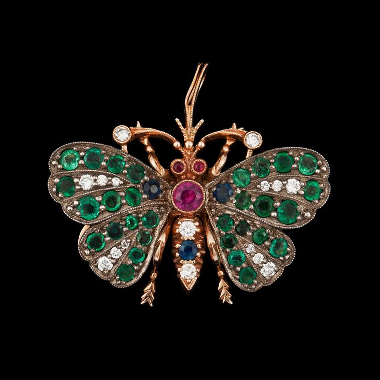 An emerald, ruby, sapphire and diamond brooch in the shape of a butterfly.