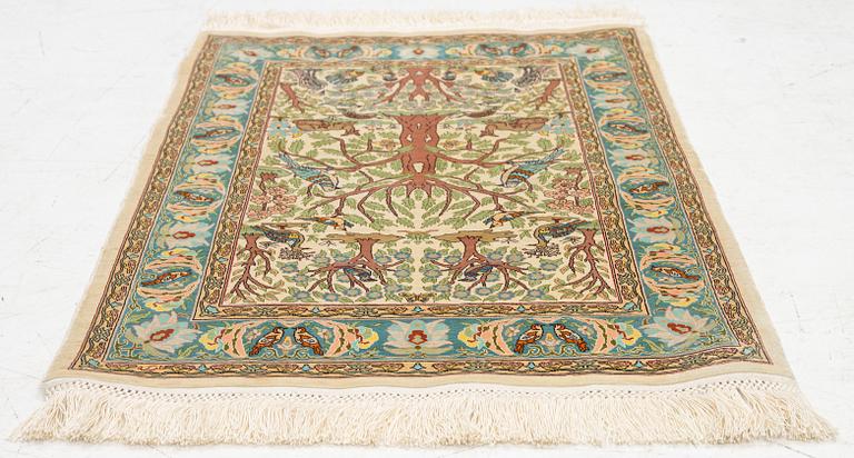 A figural silk Hereke rug, c 65 x 47 cm.
