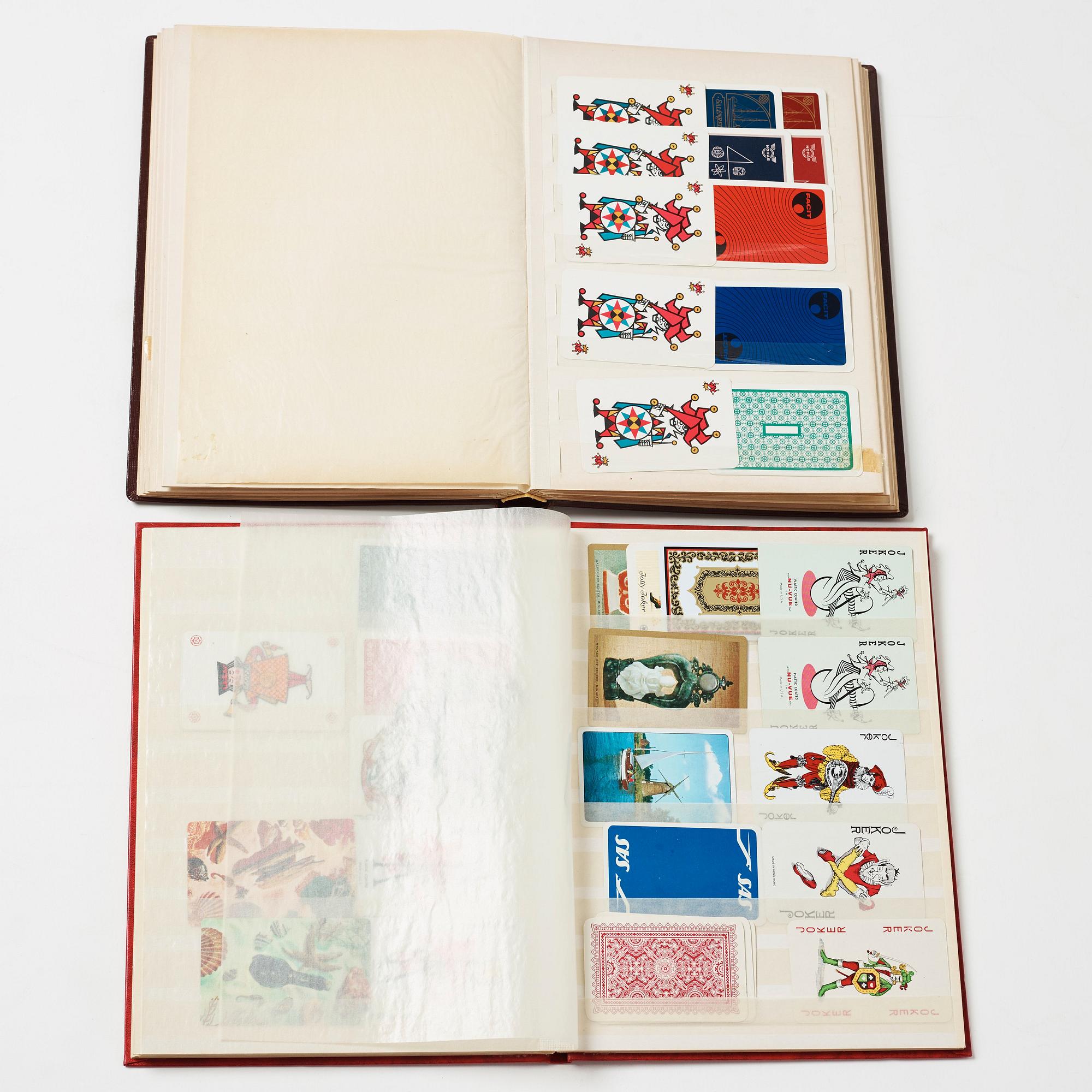 Two stamp albums with playing card collection och "Jokers".