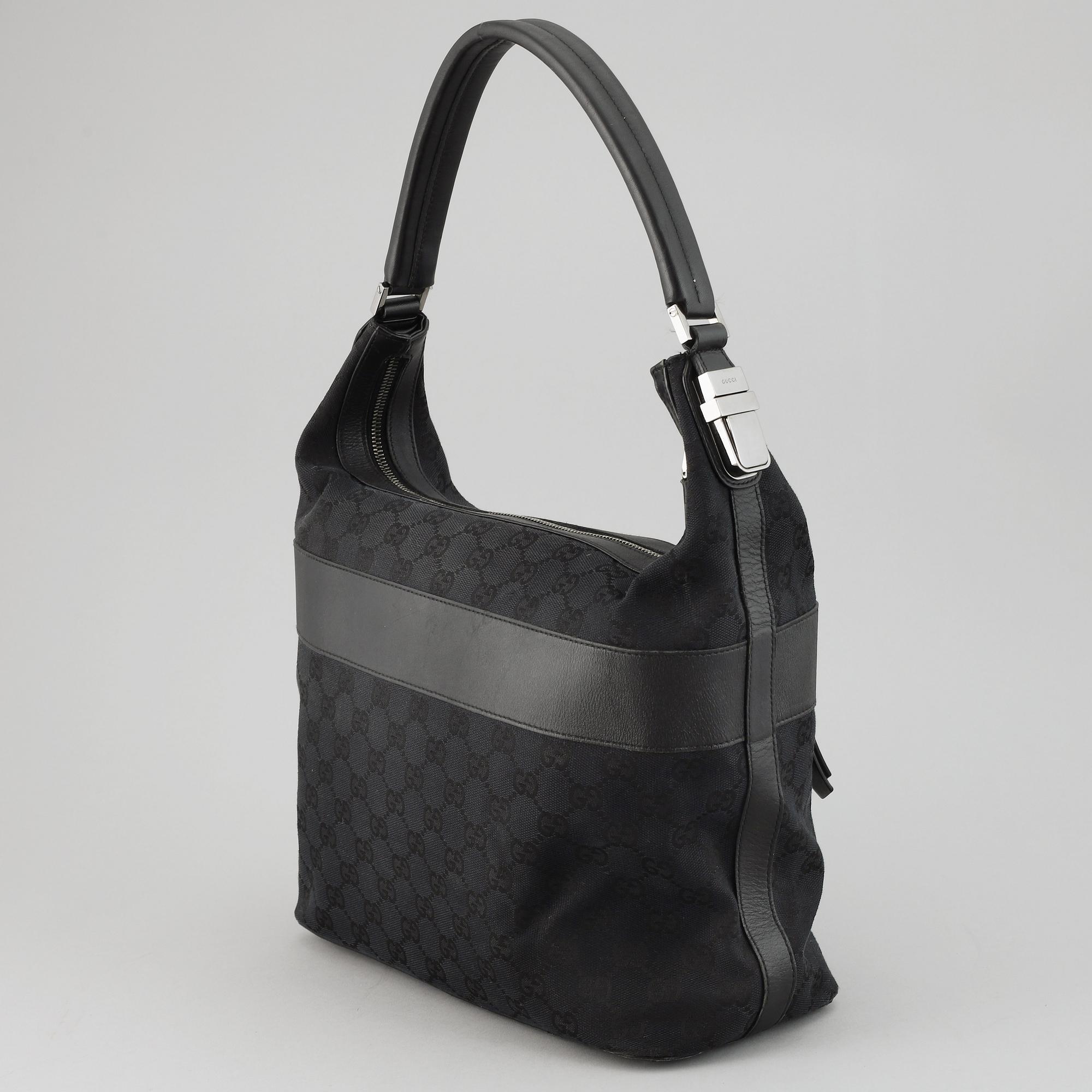 GUCCI, a canvas and leather bag.