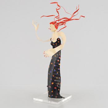 Timo Solin, Woman in patterned dress.