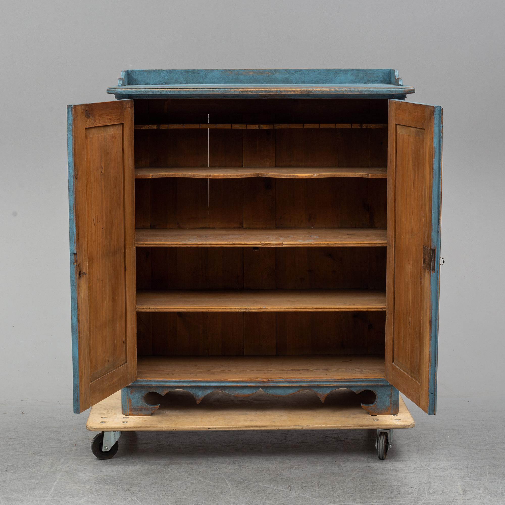 A mid 19th century painted cupboard.