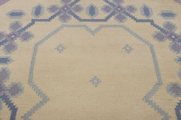 A flat weave carpet, signed MLB, ca 202 x 136 cm.