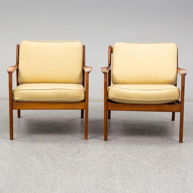 A pair of USA-75 easy chairs by Folke Ohlsson, DUX.