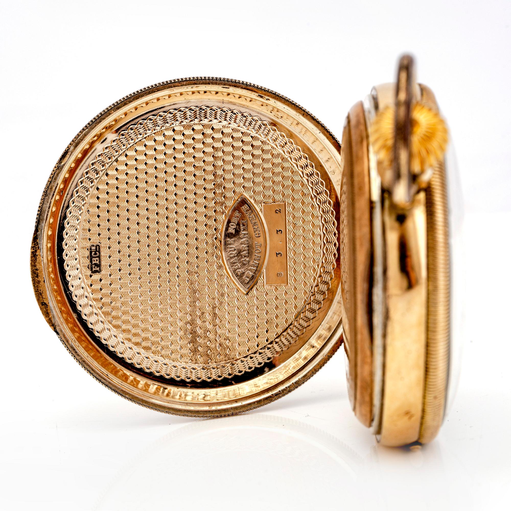 A mid 1800s gilded bronze pocket watch stand and pocket watch.