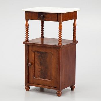 An early 20th century bedside table.