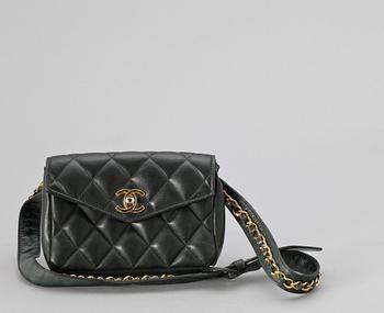 A black quilt leather bumbag by Chanel.