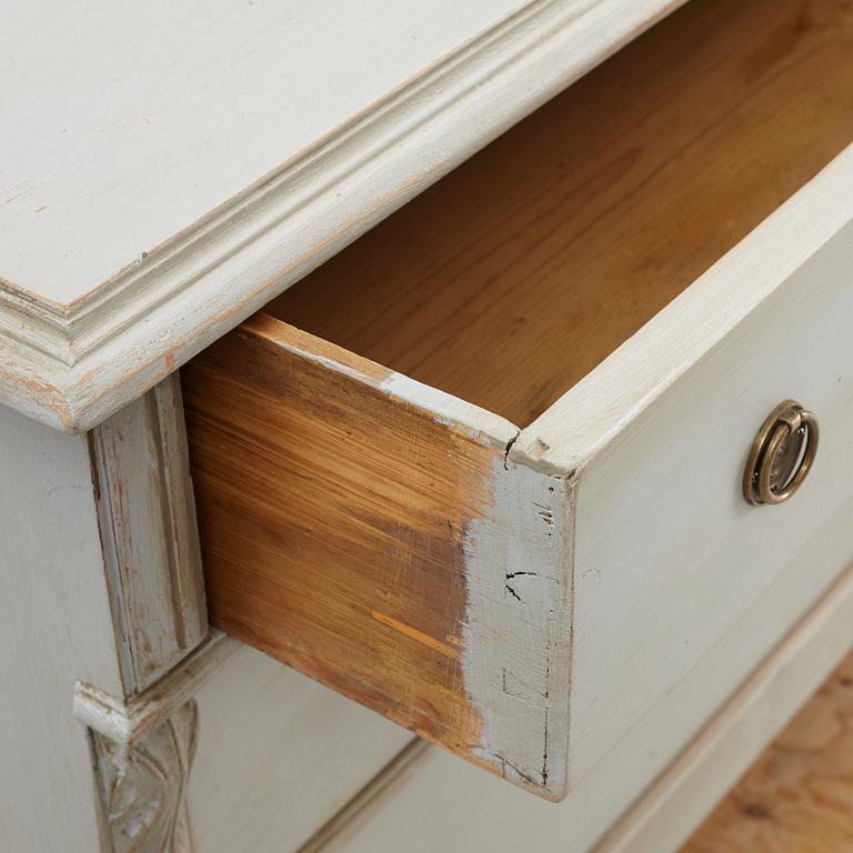 A chest of drawers, circa 1900.