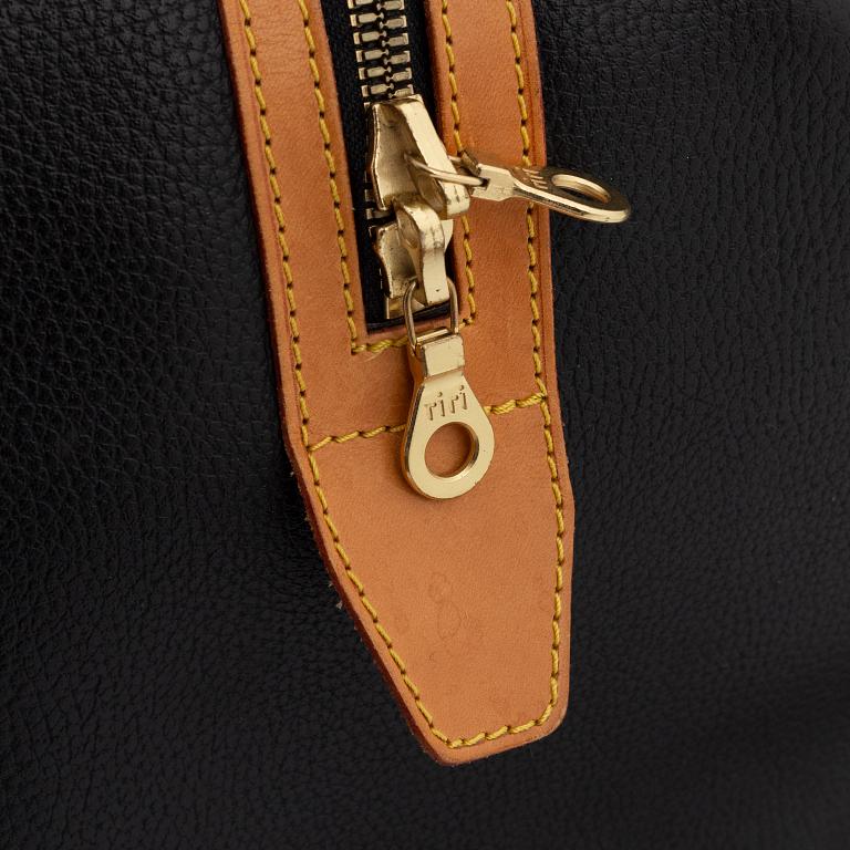 Jean Claude Jitrois, a leather weekend bag.