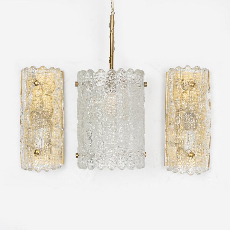 Carl Fagerlund, a pair of brass and glass wall lights and a ceiling light, Orrefors.