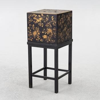 A lacquered end table/box with stand, Japan, 20th century.