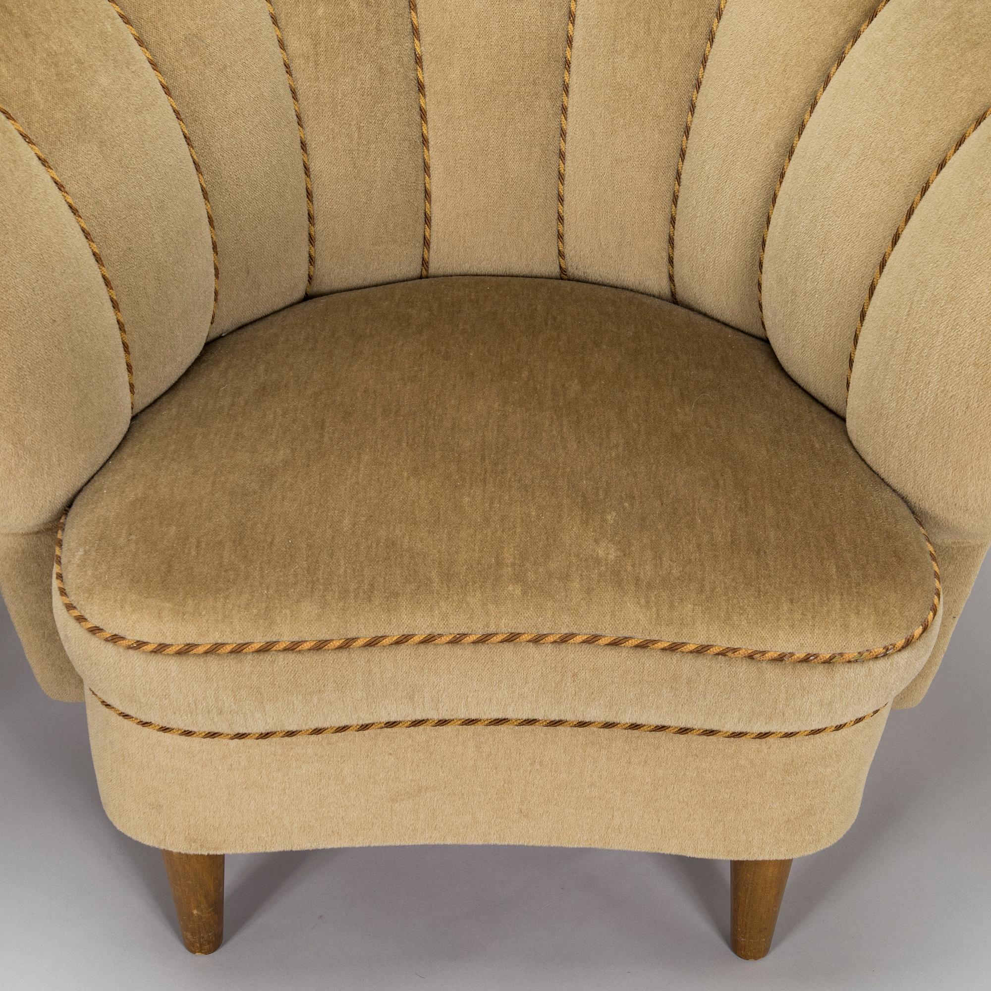 A pair of mid-20th century armchairs.