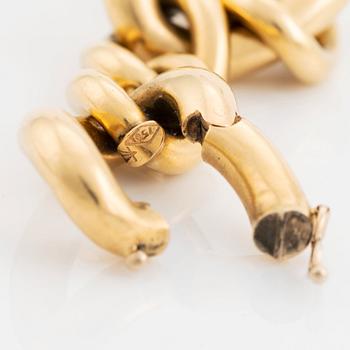 An 18K gold Tännler bracelet.