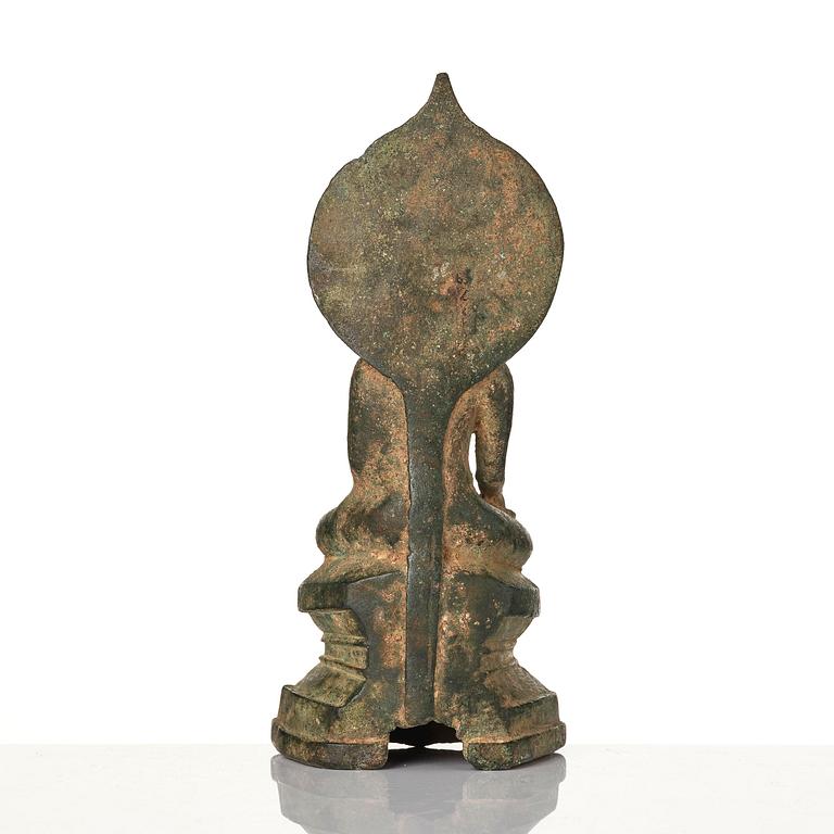 A bronze figure of Buddha with a halo, Burma, 16th century.