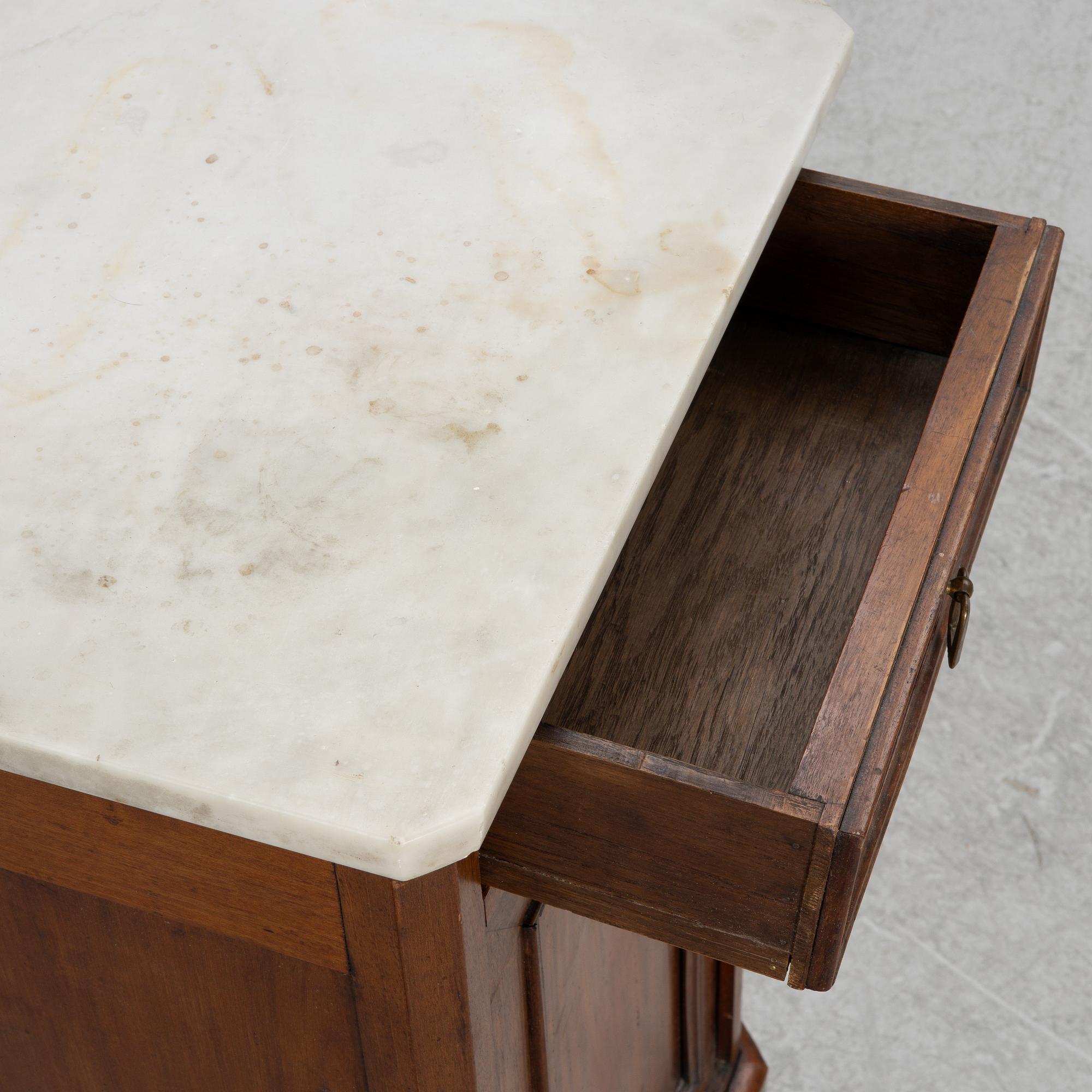 A bedside table, circa 1900.