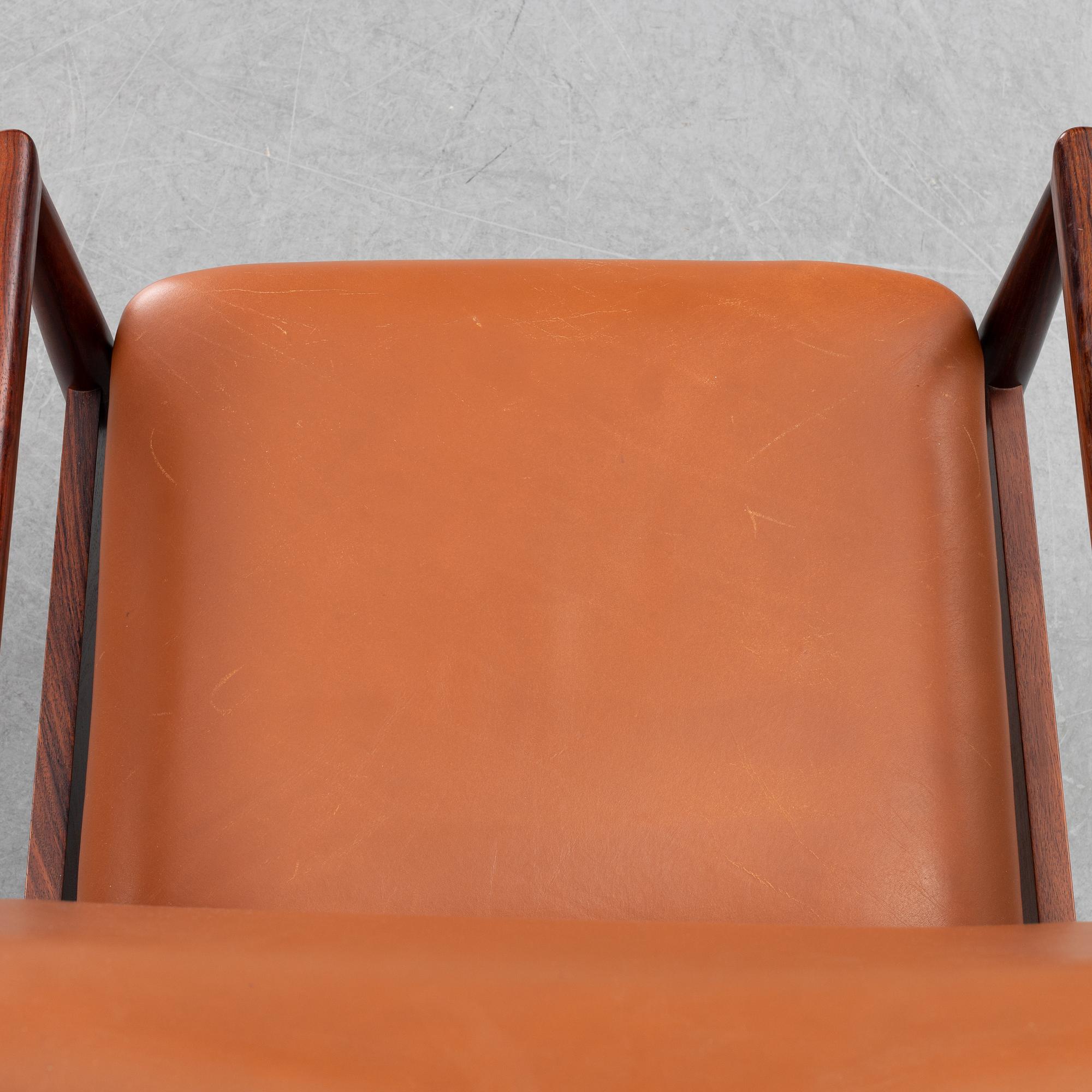 Finn Juhl, a rosewood easy chair, from Cado, Denmark, 1960's/70's.