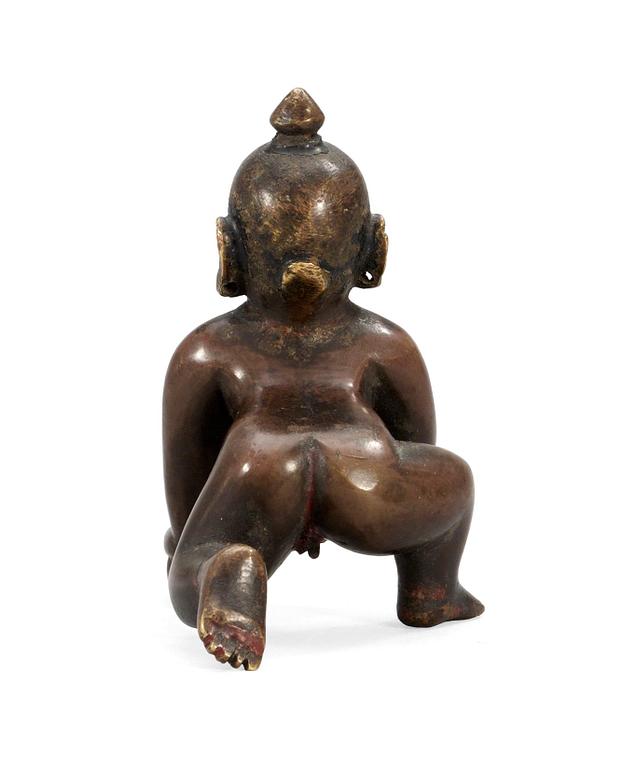 AN ASIAN BRONZE FIGURE,