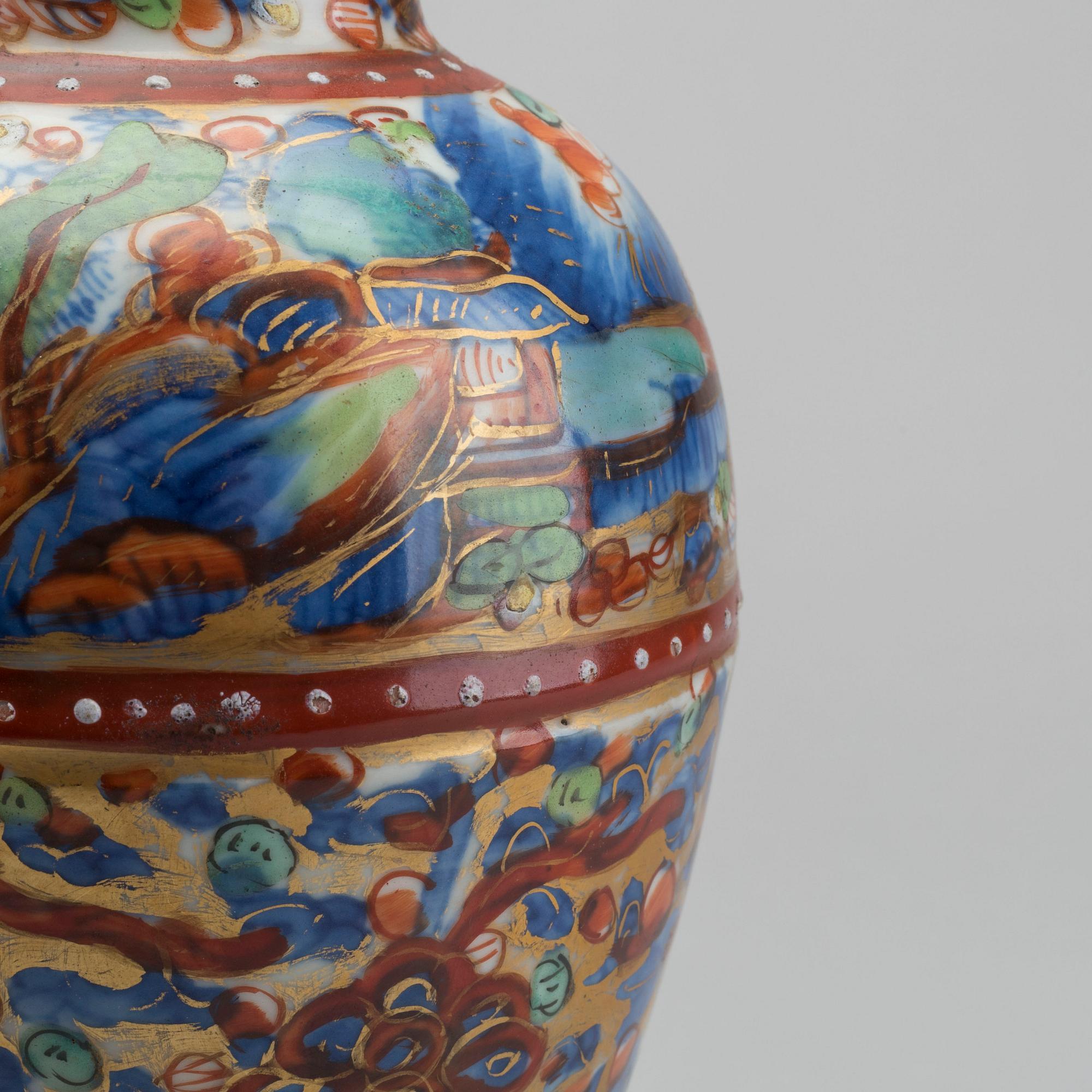 A Chinese clobbered 18th century porcelain vase, height ca 24 cm.