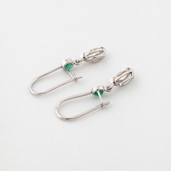 A pair of emerald and marquise cut diamond earrings.