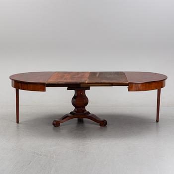 A mahogany veneered dining table, mid 19th Century.