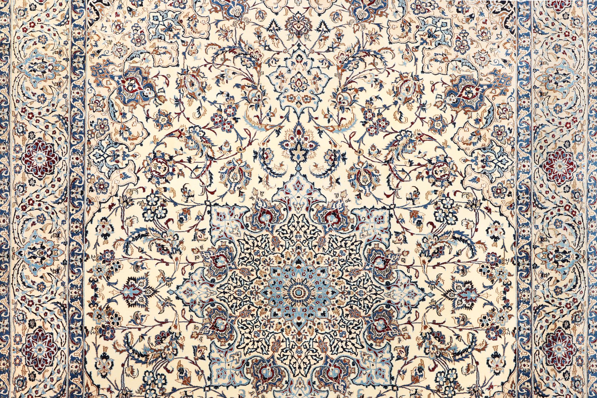 A Nain, part silk carpet, c. 474 x 322 cm.
