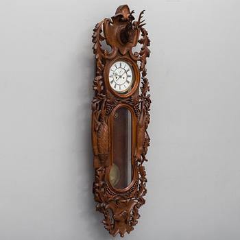 A Lenzkirch walnut wall clock from Germany, 1910s / 20s.