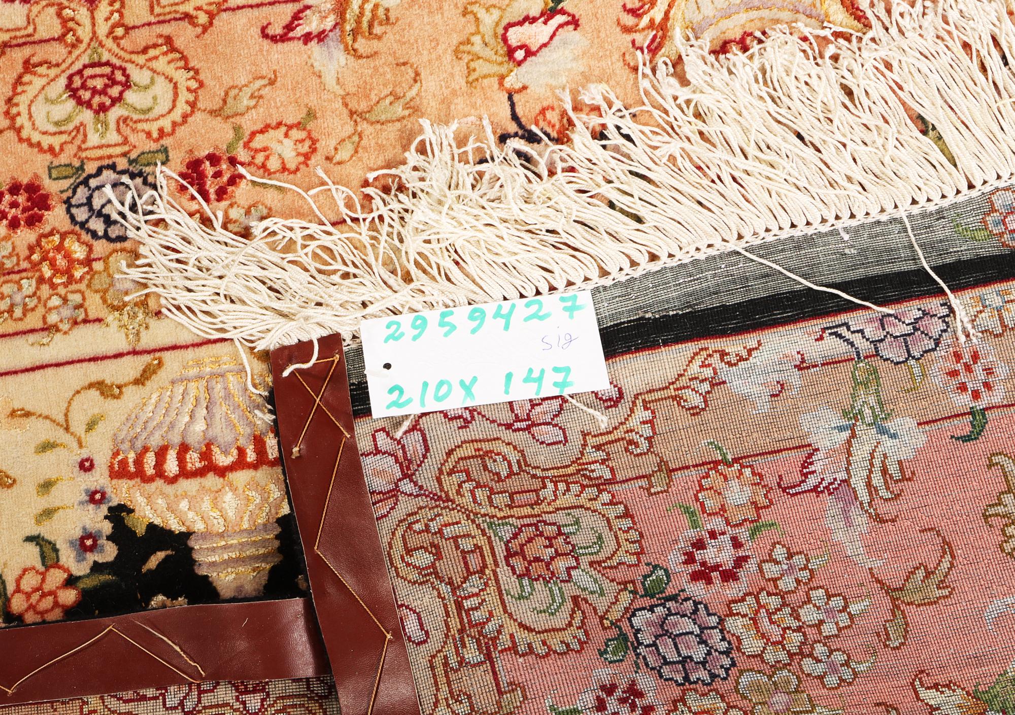 A Tabriz rug, a. 210 x 147 cm.