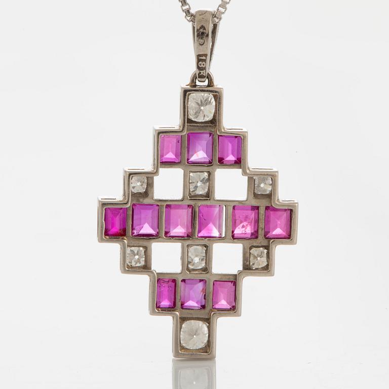 An 18K white gold pendant set with step-cut rubies and old-cut dimonds.