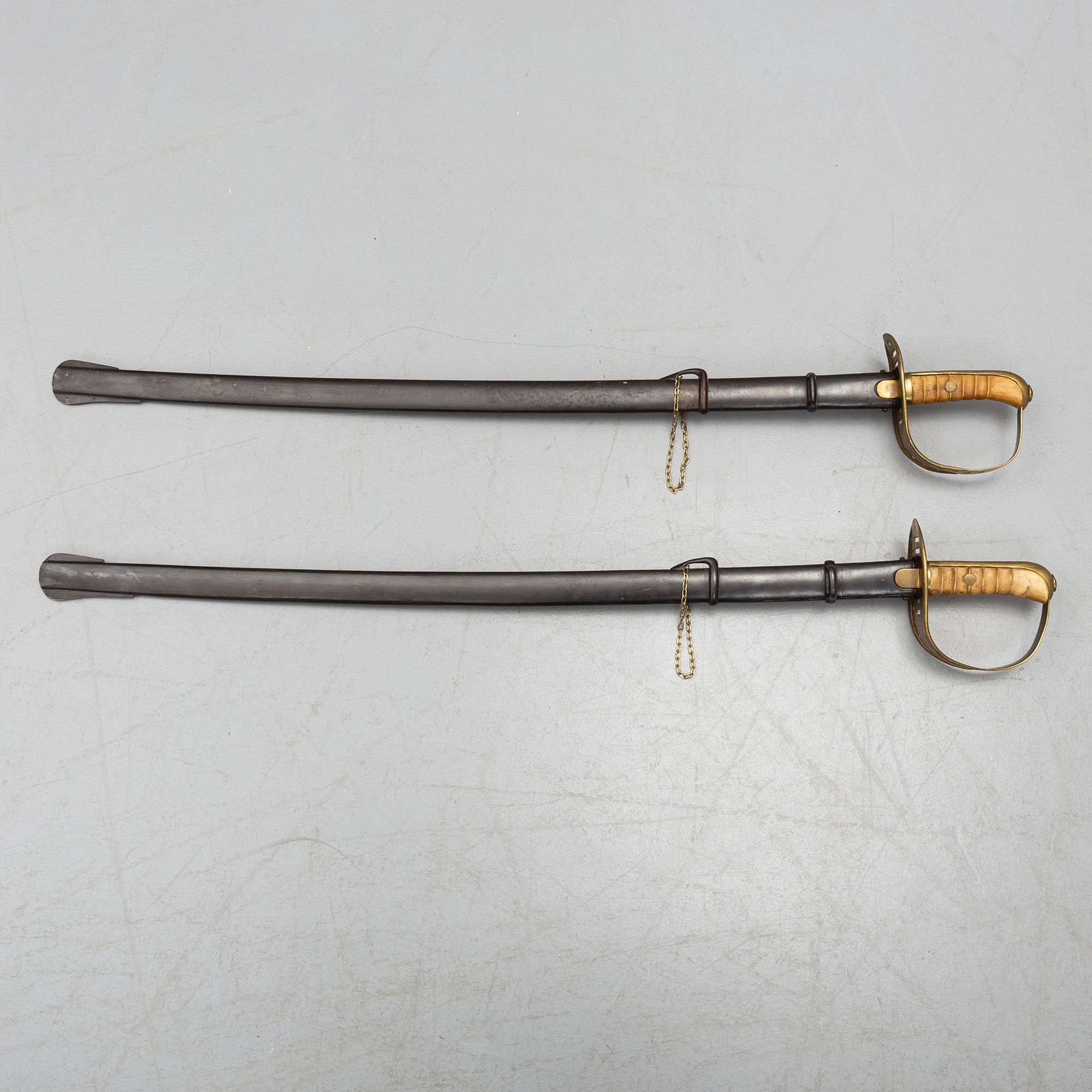Two cavalry sabres 1867 pattern with scabbards.