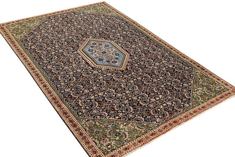 A carpet, Tabriz, ca 288 x 181 cm.