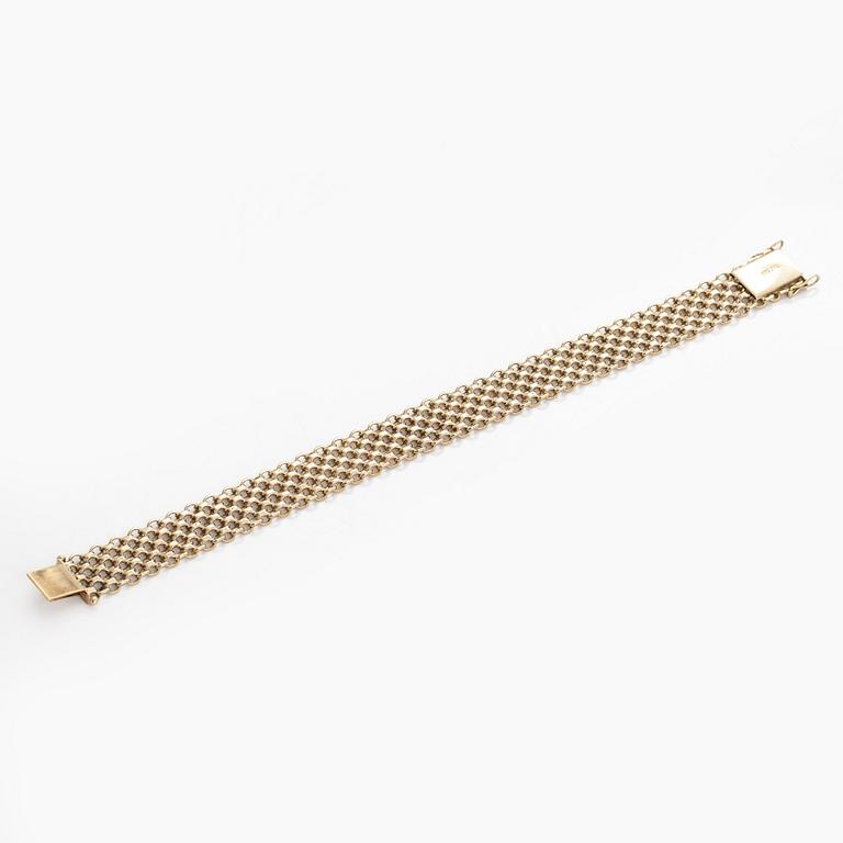 A 14K gold X-link bracelet, likely Norway.