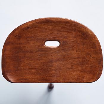 Josef Frank, a three legged mahogany stool, model 336, Svenskt Tenn, Sweden 1940-1950s.