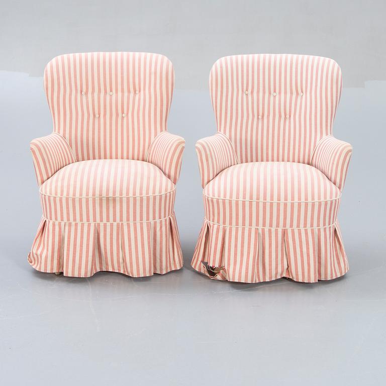 A pair of Modern easy chairs.