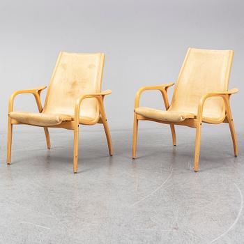 A pair of Laminett Yngve Ekström chairs.