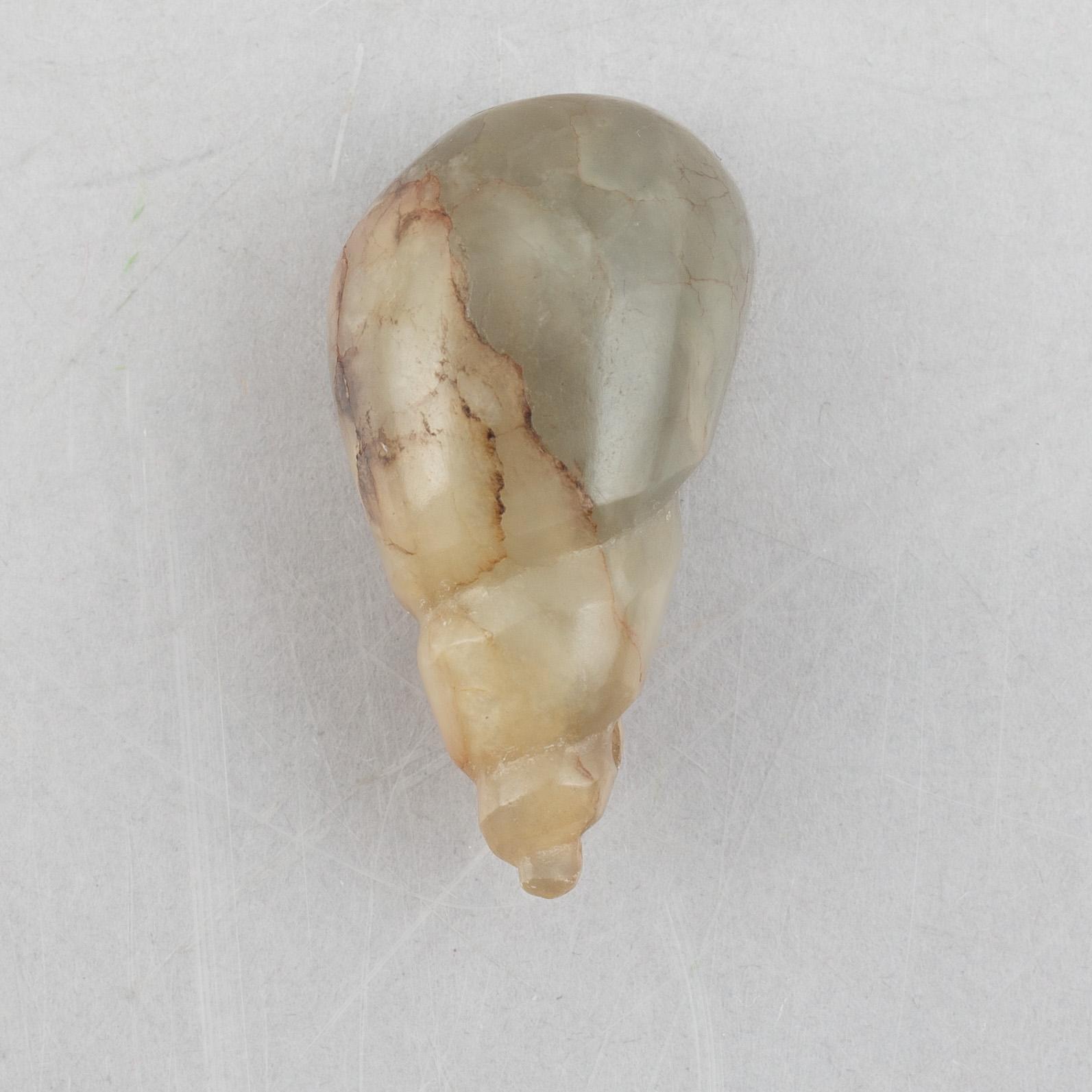 A group of three Chinese stone charms, 20th century.