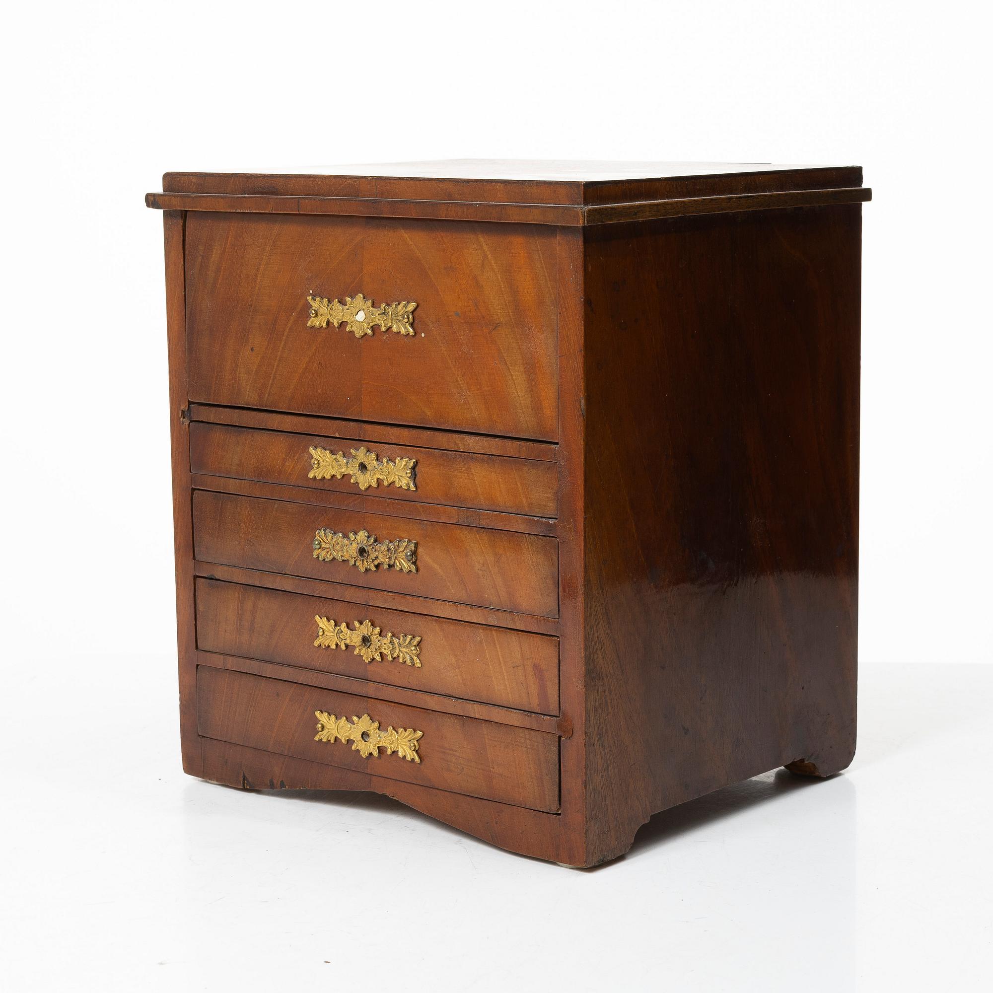 A Swedish Empire mahogany minature commode, first part 19th century.