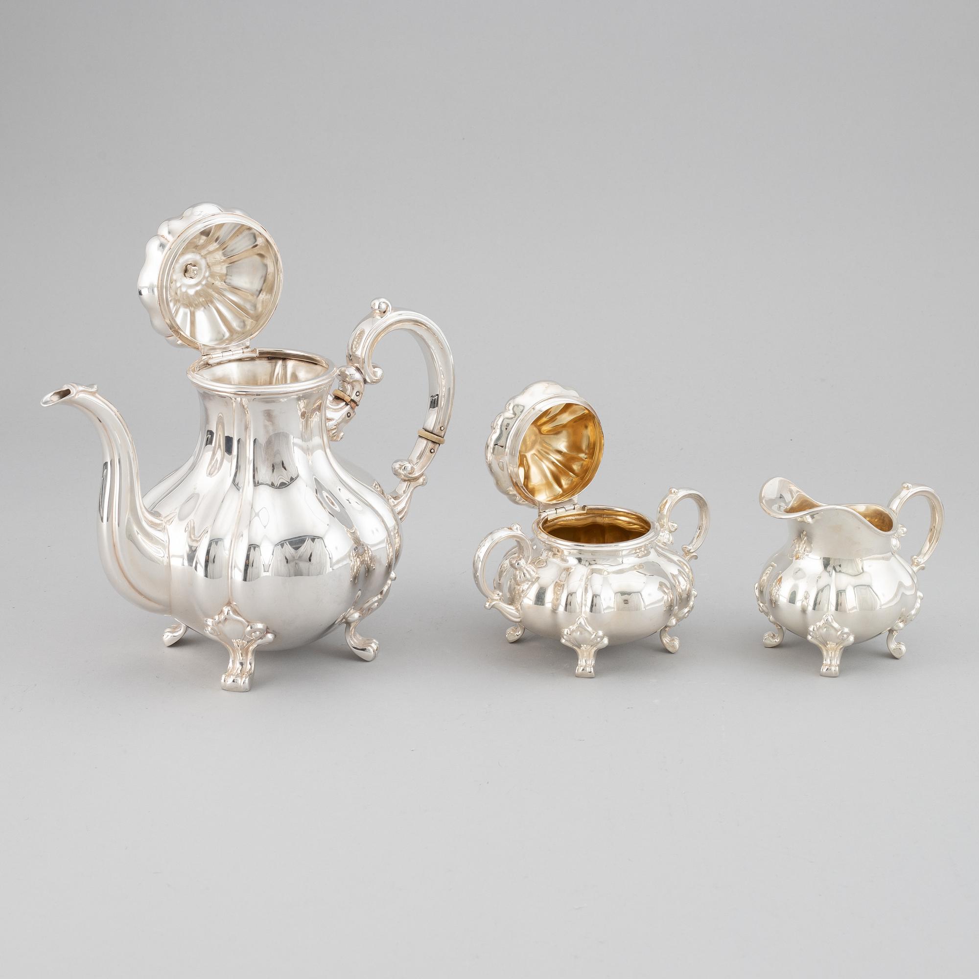 A 20th century silver coffee pot, creamer and sugar bowl. Swedish import mark.