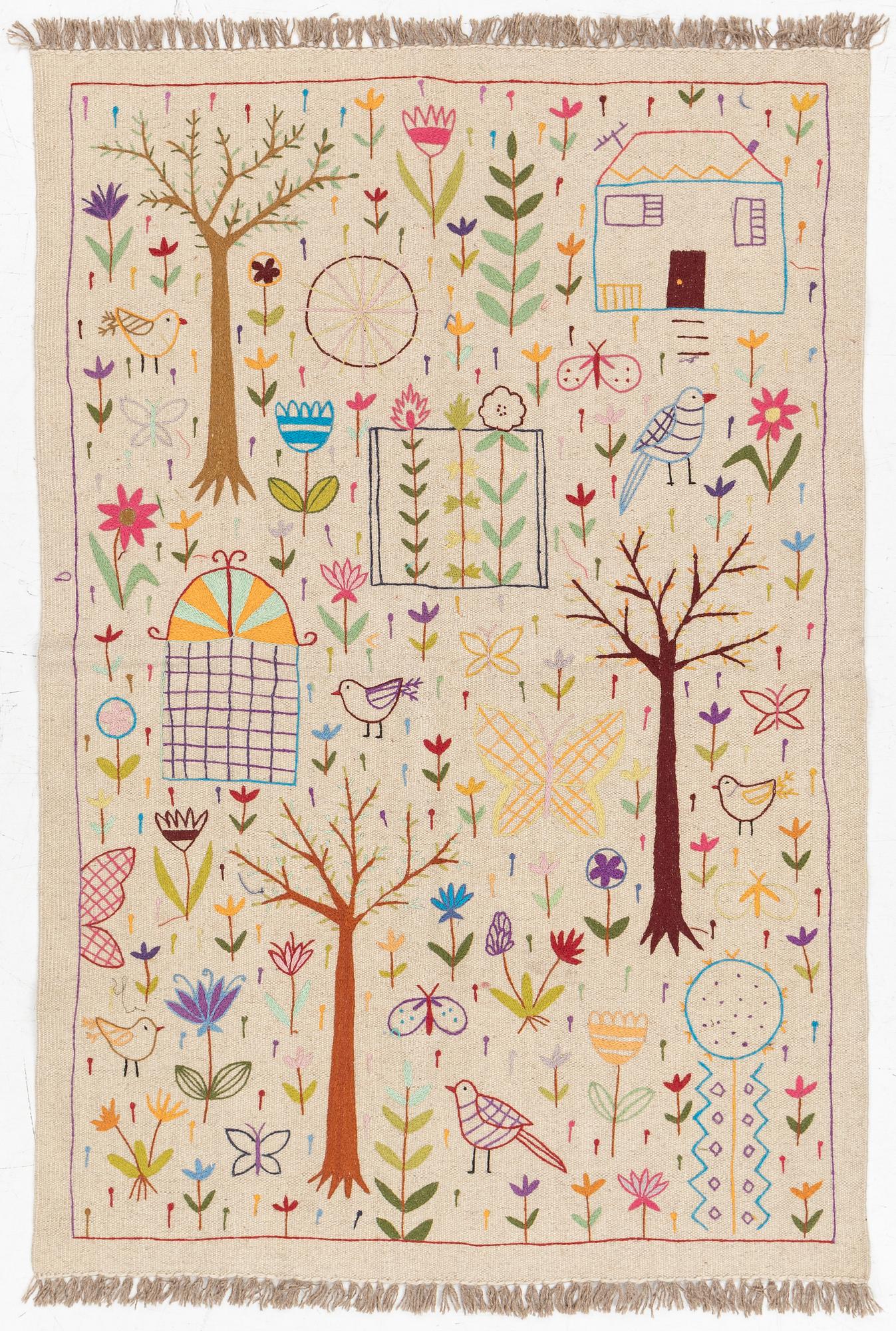 A hand-embroidered Kelim rug, c. 177 x 122 cm.