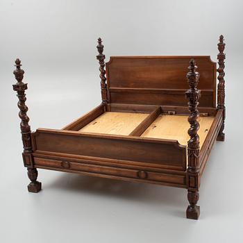 A carved Baroque style bed, early 20th Century.
