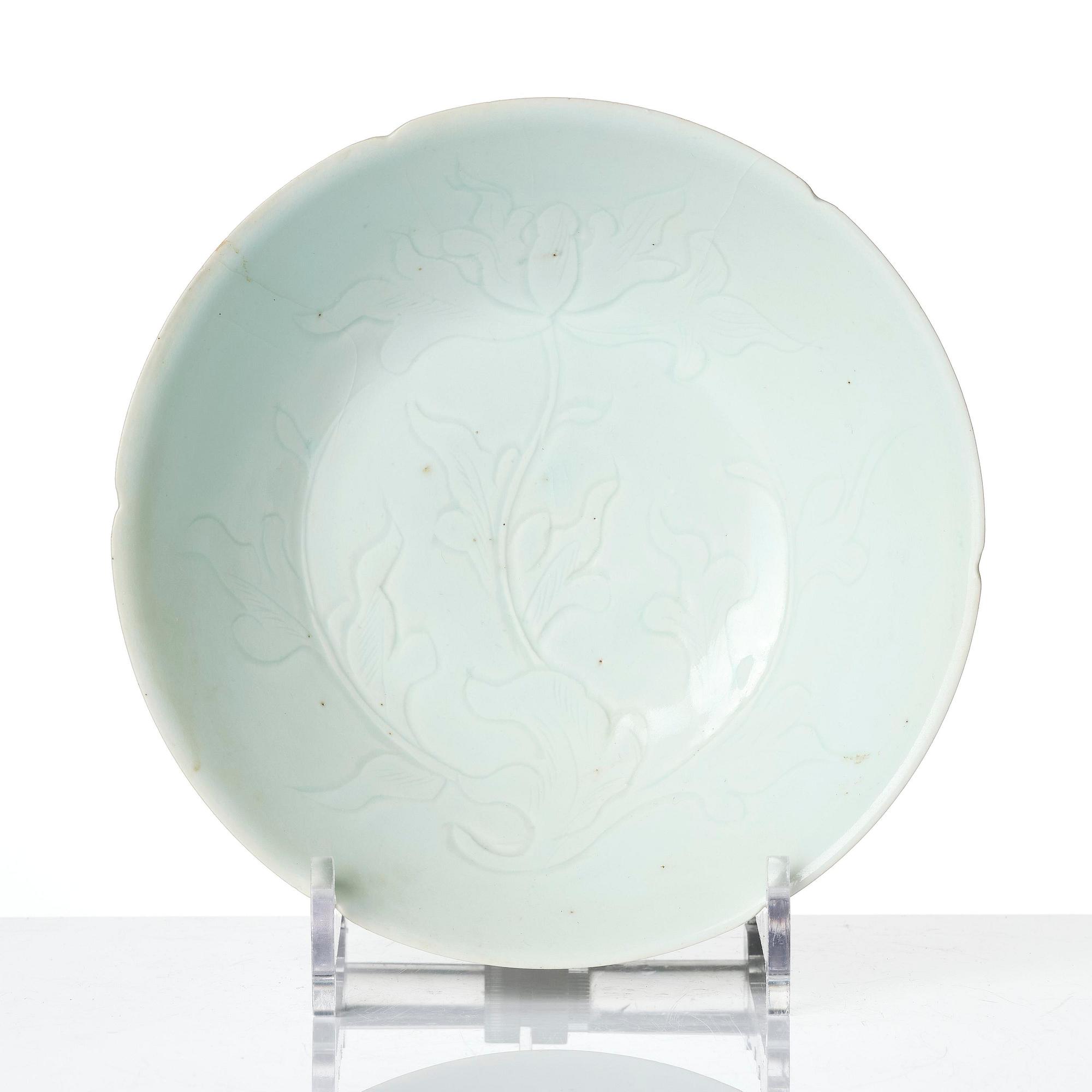 A carved qingbai foliate bowl, Song dynasty (960-1279).